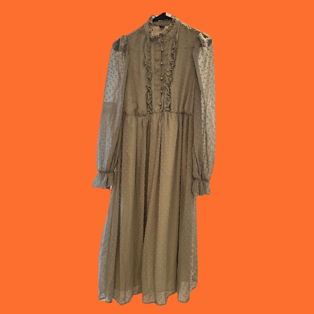 Sage green maxi dress with sheer polka dot sleeves and ruffle collar.